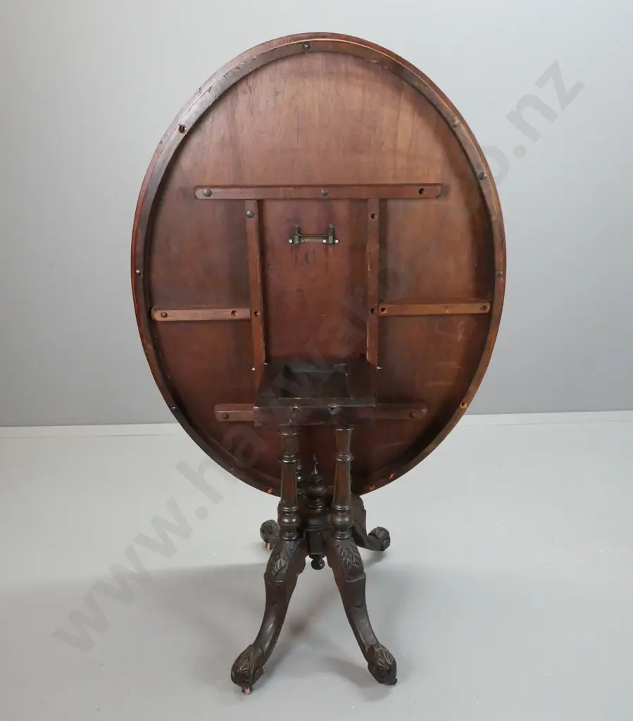 Victorian walnut oval loo table on 4-point cathedral base, stringing and inlay to top, carved legs, working tilt Image 1++