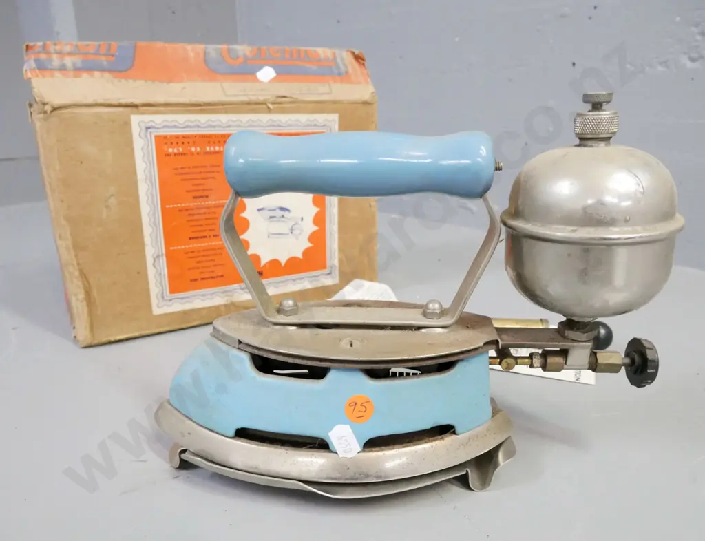 boxed Coleman self-heating iron, made in Canada. Includes operating manual, small pump, trivet. Iron H-190 W-270 Image 1++