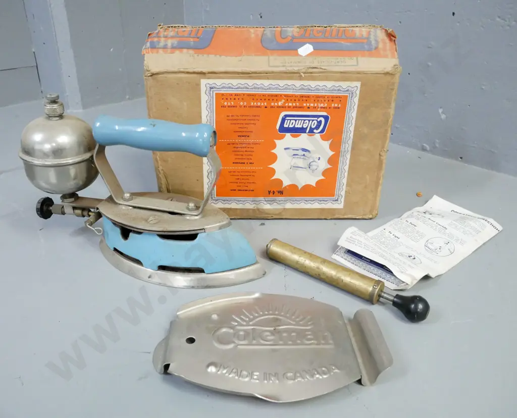 boxed Coleman self-heating iron, made in Canada. Includes operating manual, small pump, trivet. Iron H-190 W-270 Image 1++