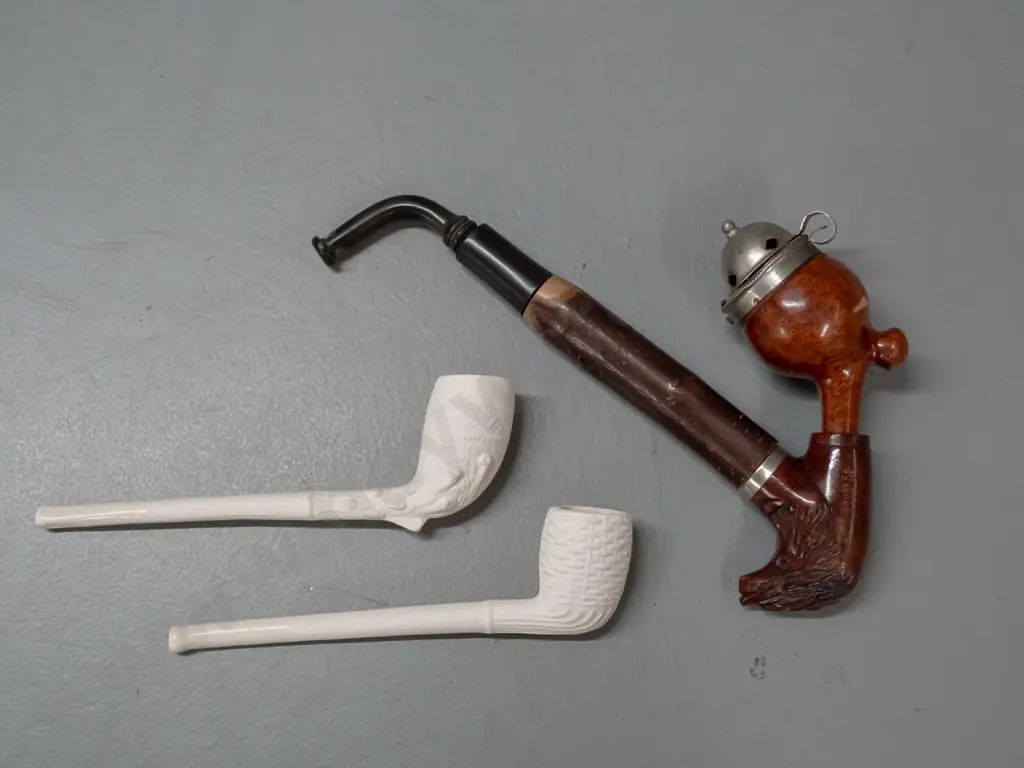 3 smoking pipes - vintage briar w/ carved goat head motif, marked Bruyere Garantie, and 2 moulded clay Image 1++