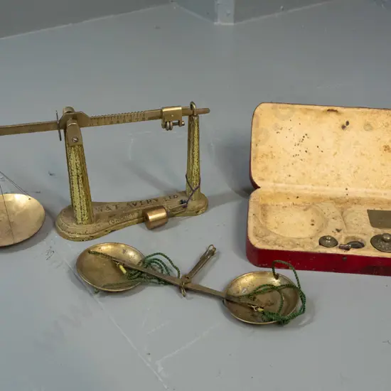 2 vintage balance scales - one gold scales set with some parts missing, one Avery with cast iron base may be missing