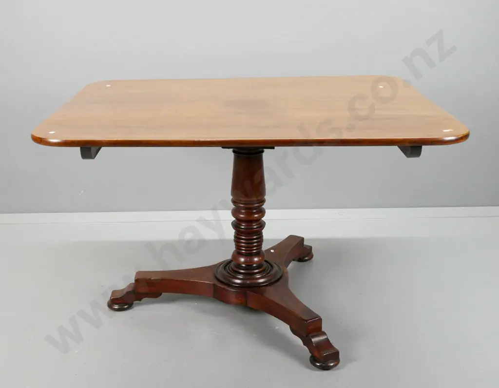 Georgian mahogany pedestal based tilt-top breakfast table with rectangular top, turned column on tri-form platform base. Image 1++