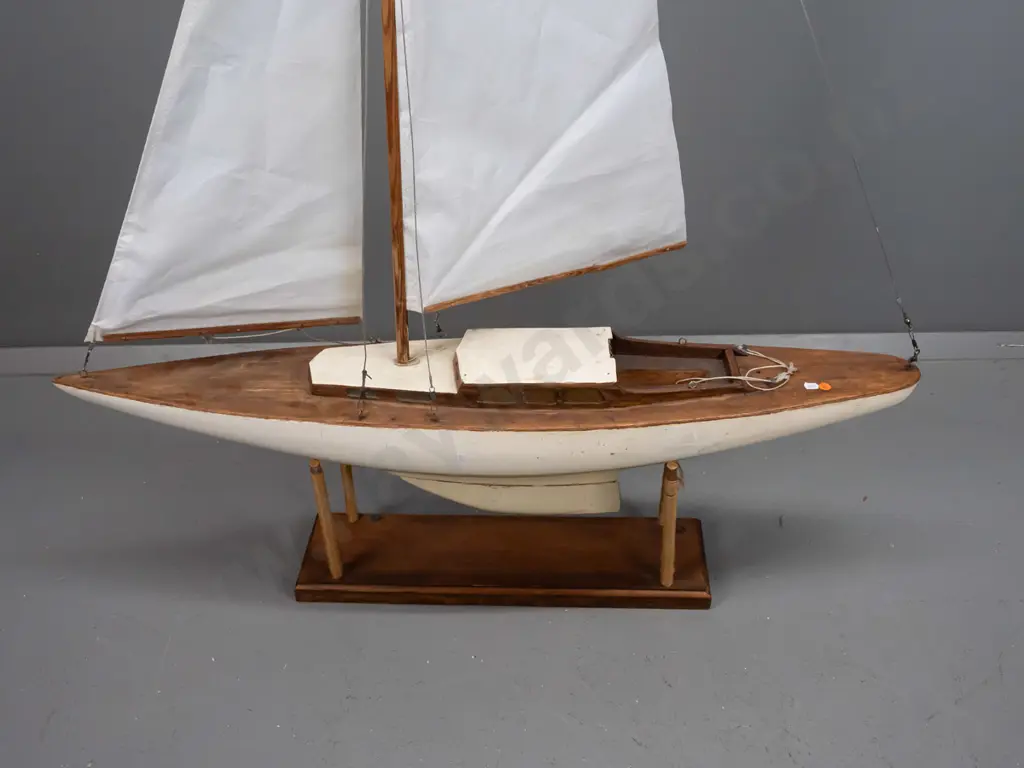 vintage pond yacht on wooden stand, has had sails replaced, one sail boom is broken, some age wear and damage, two Image 1++
