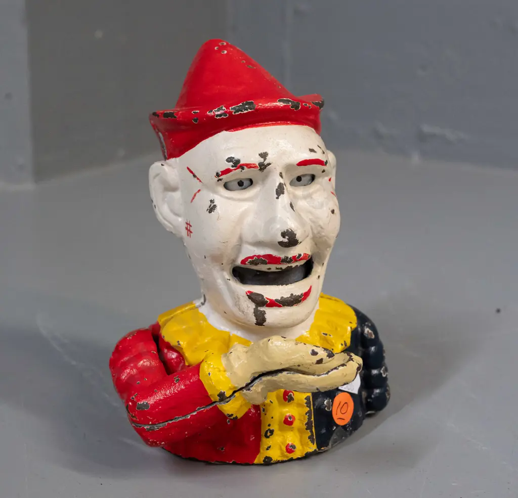 cast metal clown money box with tilting arm mechanism - has paint wear / chipping H-190 W-140 Image 1++