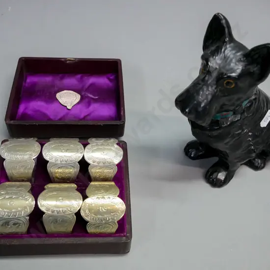 Boxed set of six napkin rings, Black plaster scotty dog