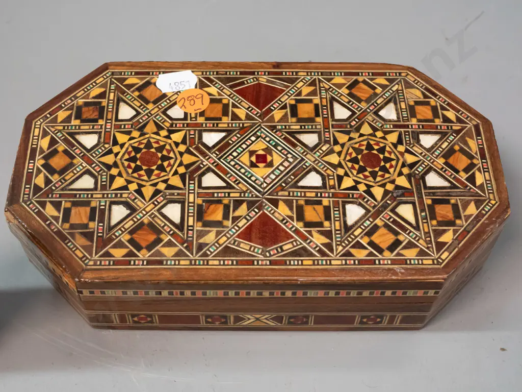 small hinged lid box with geometric mixed timber and mother of pearl inlaid decoration and a small African (Zaire) Image 1++