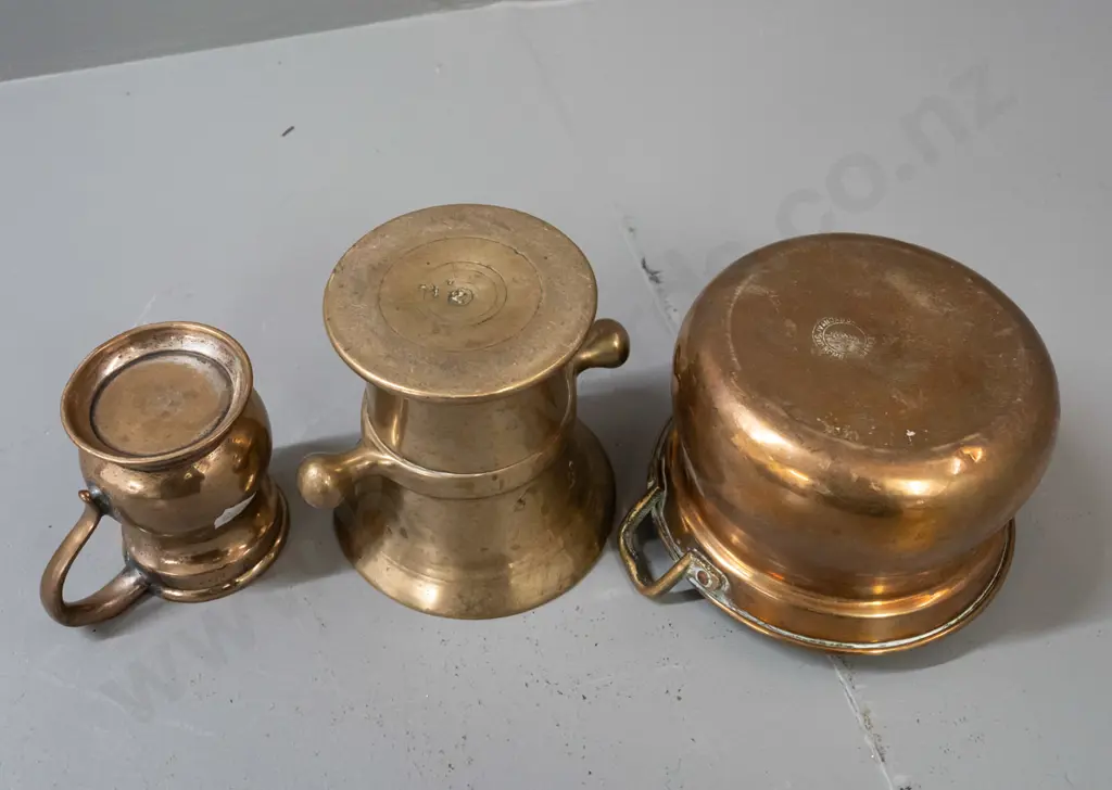 3 brass vessels - heavy cast mortar with side lugs H110, a handled gill measuring cup, and brass plated Indian double Image 1++