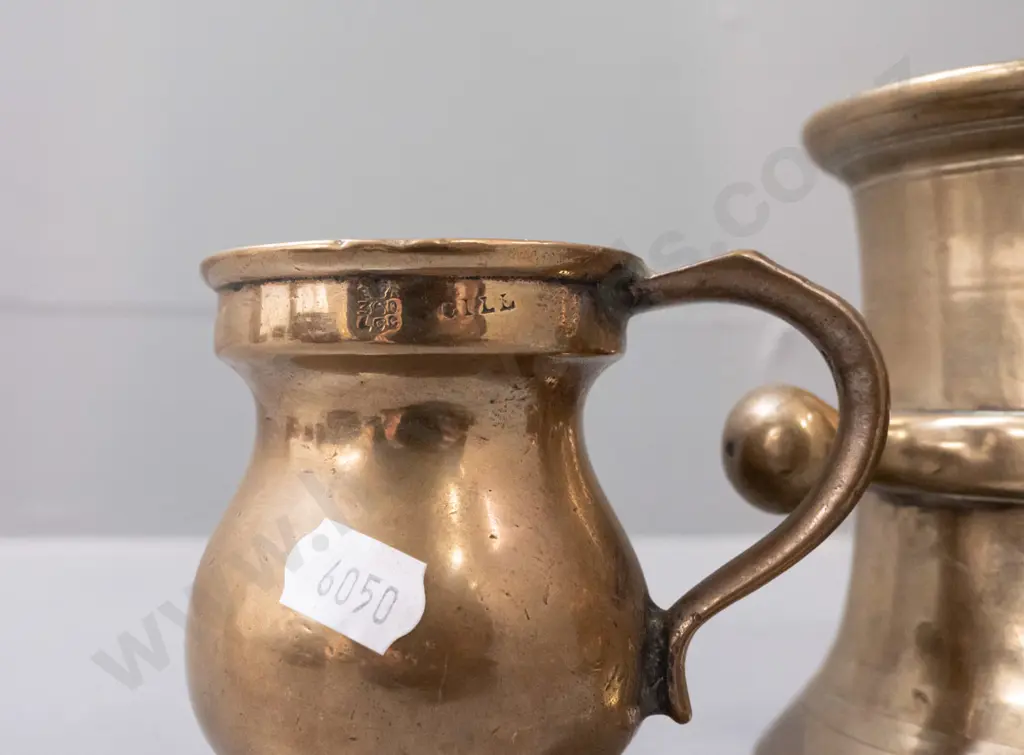 3 brass vessels - heavy cast mortar with side lugs H110, a handled gill measuring cup, and brass plated Indian double Image 1++
