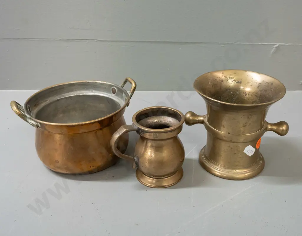 3 brass vessels - heavy cast mortar with side lugs H110, a handled gill measuring cup, and brass plated Indian double Image 1++