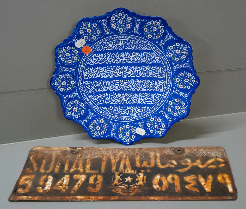 Iranian Minakari enamel metal plate with koranic verse, hanging loop on back D-240 and a rusty Somali number plate. Image 1++