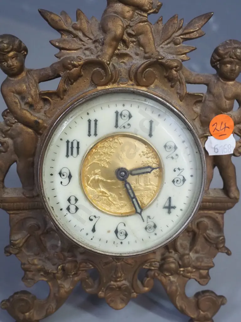 ornate vintage clock in gilded cast metal case with gilded metal and porcelain face, glow in the dark detail on hands, Image 1++