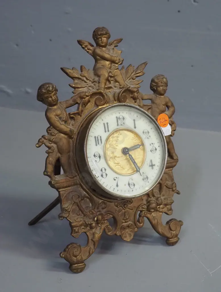 ornate vintage clock in gilded cast metal case with gilded metal and porcelain face, glow in the dark detail on hands, Image 1++