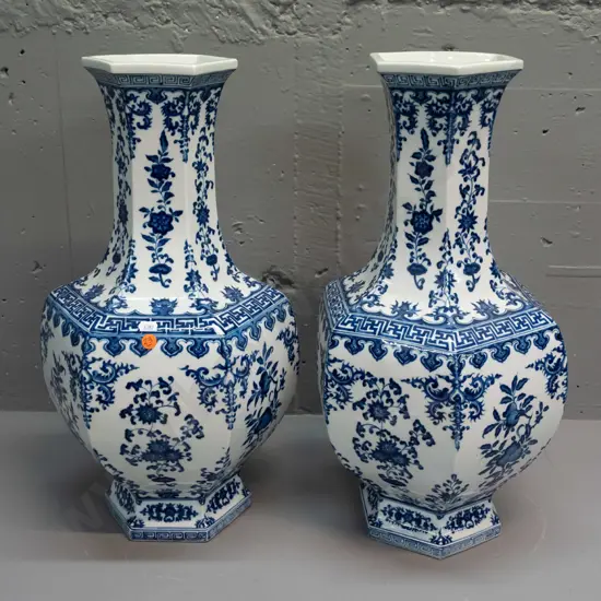 pair of heavy blue and white Chinese vases with faceted hexagonal shape at top - see photo for character mark on base
