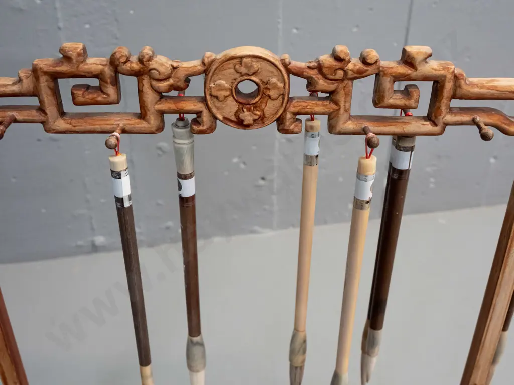 Chinese intricately craved timber brush stand with 8 brushes - missing one small hanging peg, finish is worn overall Image 1++