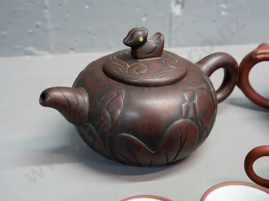 3 Chinese Yixing clay tea pots and 2 small tea bowls, one with leaf & tree forms has small chip in underside of lid, is Image 1++