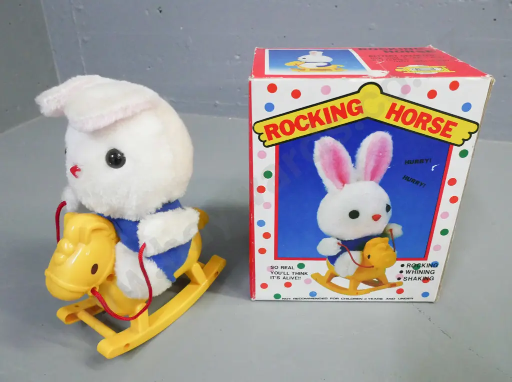 boxed battery operated rocking horse. Made in Taiwan. Powers up. Some wear to cardboard box. Box H-210 W-170 D-120 Image 1++