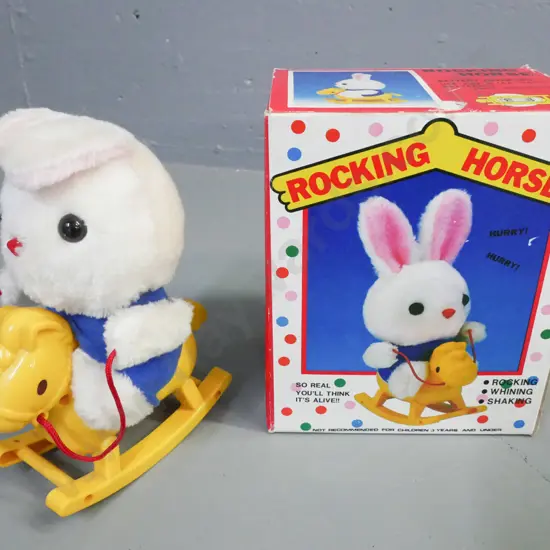 boxed battery operated rocking horse. Made in Taiwan. Powers up. Some wear to cardboard box. Box H-210 W-170 D-120