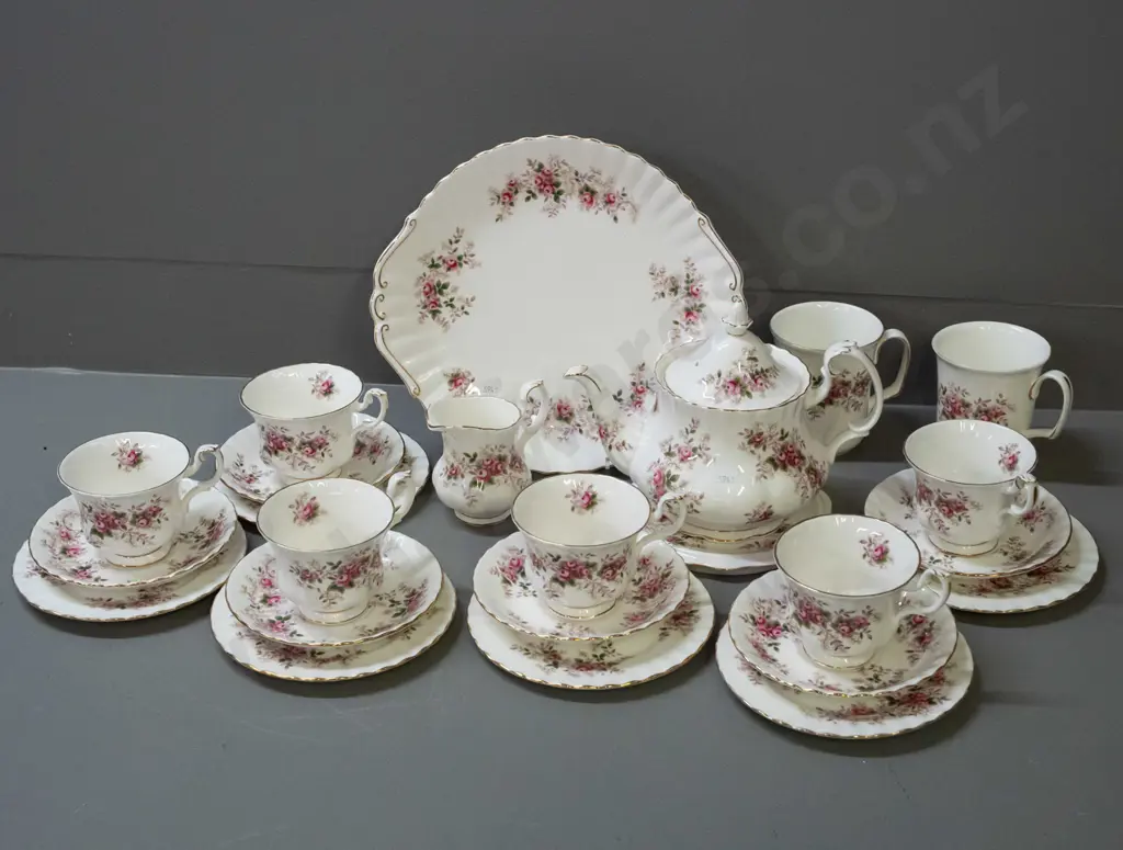 Royal Albert Lavender Rose tea set: 6 trios, teapot w/ stand, cake plate, creamer and 2 mugs, no sugar bowl. Plate W275 Image 1++