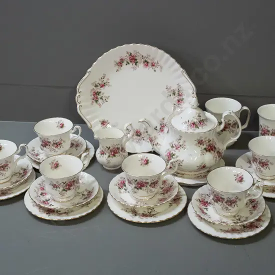 Royal Albert Lavender Rose tea set: 6 trios, teapot w/ stand, cake plate, creamer and 2 mugs, no sugar bowl. Plate W275
