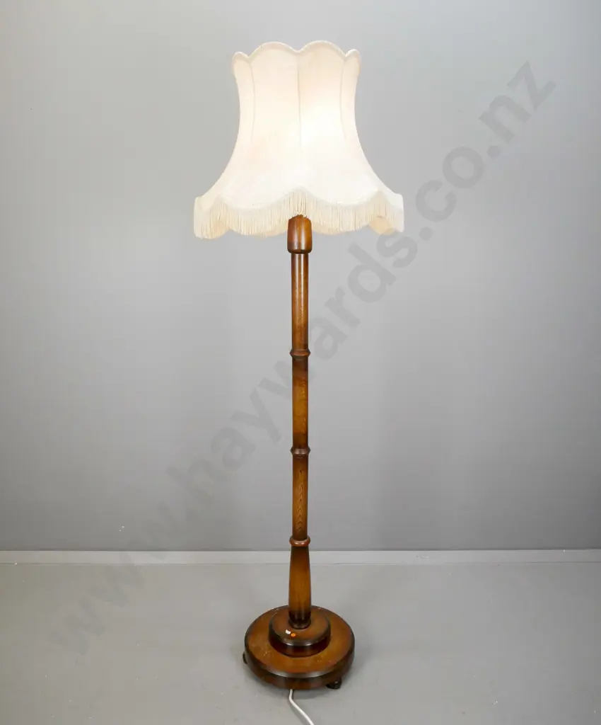 vintage oak standard lamp with segmented turned column on circular stepped base w/3 turned feet, with waisted & frilled Image 1++