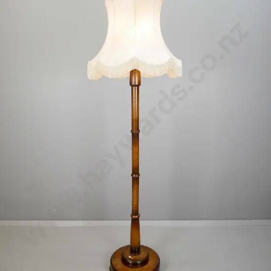 vintage oak standard lamp with segmented turned column on circular stepped base w/3 turned feet, with waisted & frilled