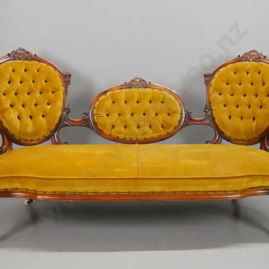 Victorian walnut cameo-back open-armed settee w/fluted supports, turned front legs, deep-button back in gold fabric, one