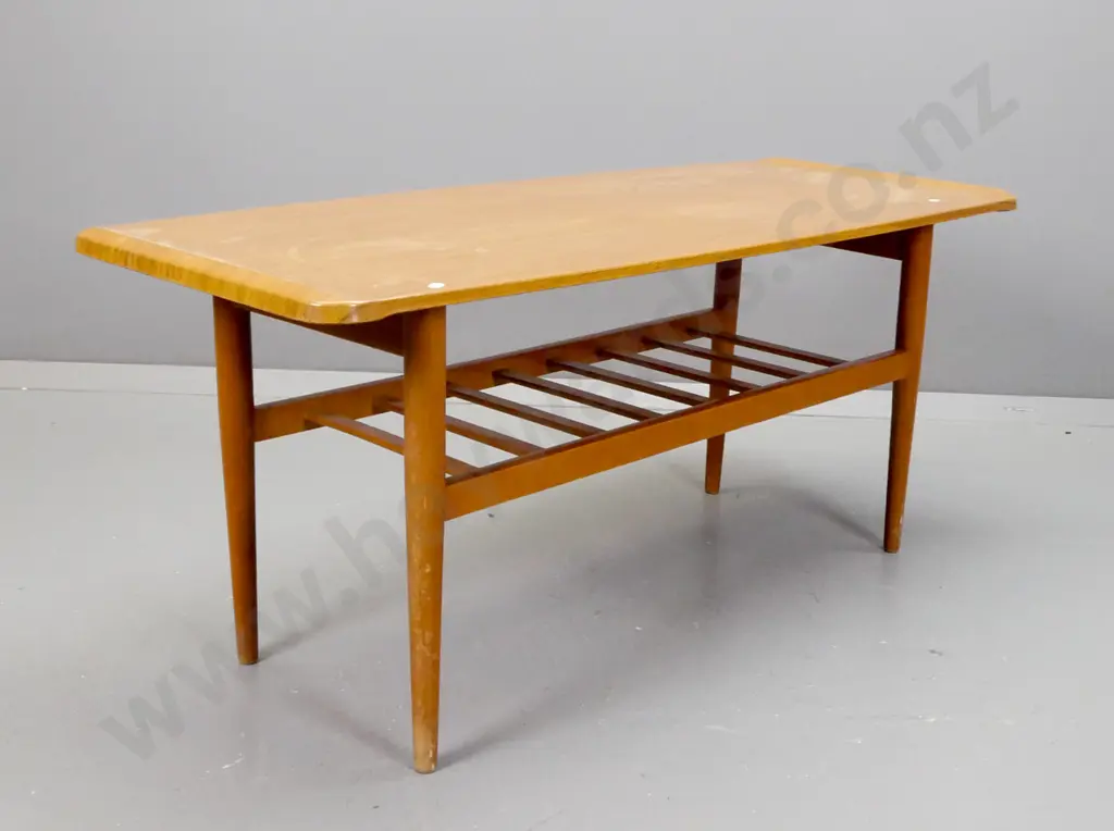 retro coffee table faux teak veneer top on round tapered legs with slatted magazine rack. H-470 W-1070 D-420 Image 1++
