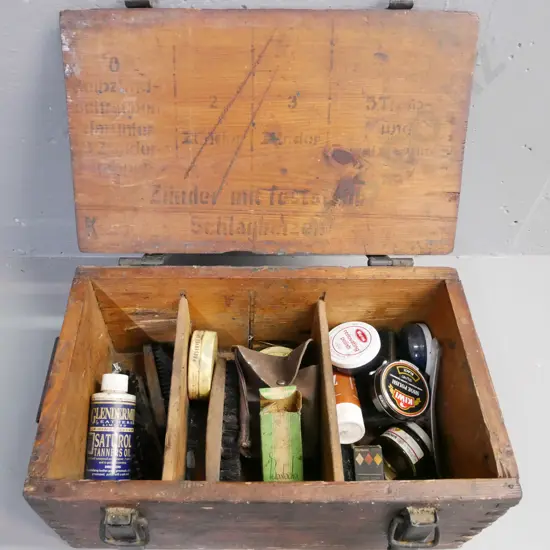 vintage pine metal-strapped German munitions box with shoe polishing and leather cleaning products.