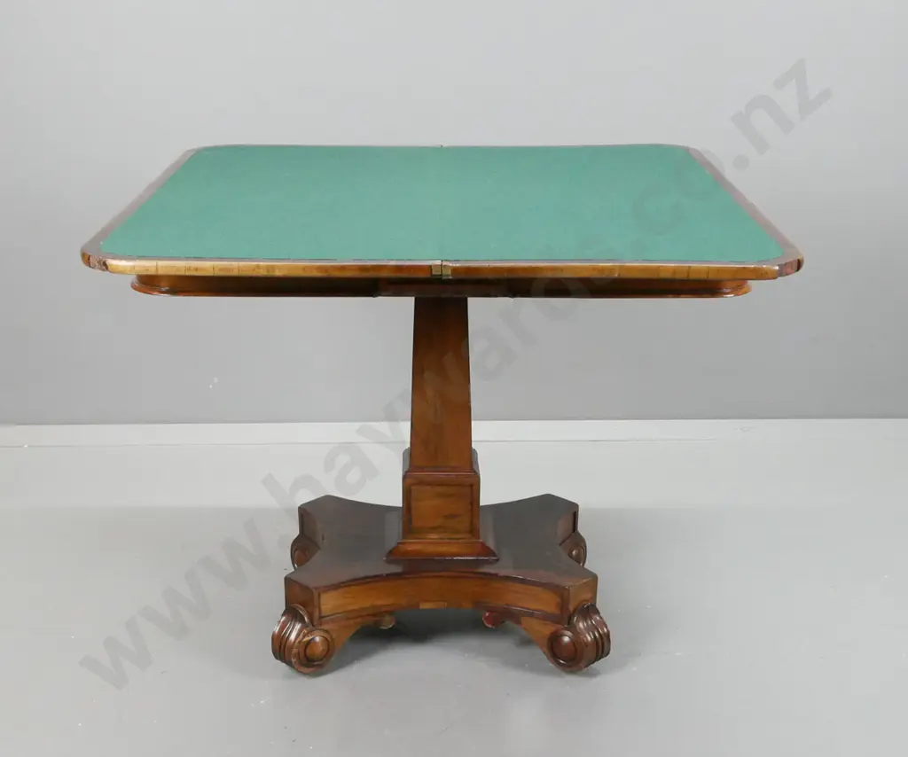 William IV rosewood and walnut card table with fold out revolving top, tapered column base on 4 swirling foliate feet. Image 1++
