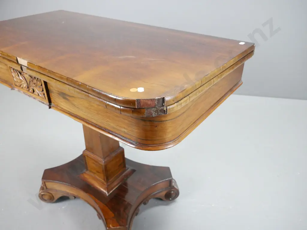 William IV rosewood and walnut card table with fold out revolving top, tapered column base on 4 swirling foliate feet. Image 1++