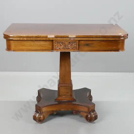 William IV rosewood and walnut card table with fold out revolving top, tapered column base on 4 swirling foliate feet.