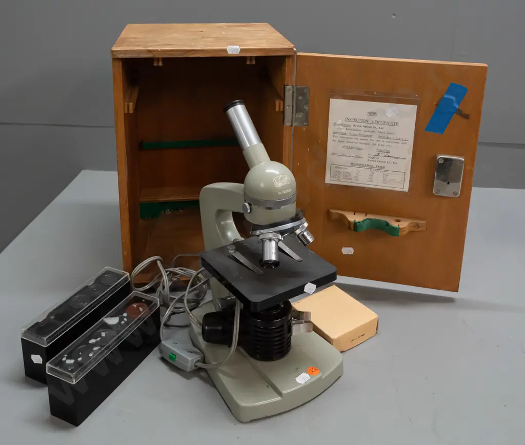 cased Kyowa Tokyo microscope in fitted wood case with 2 extra eyepieces and 1 objective in 2 plastic containers. Image 1++