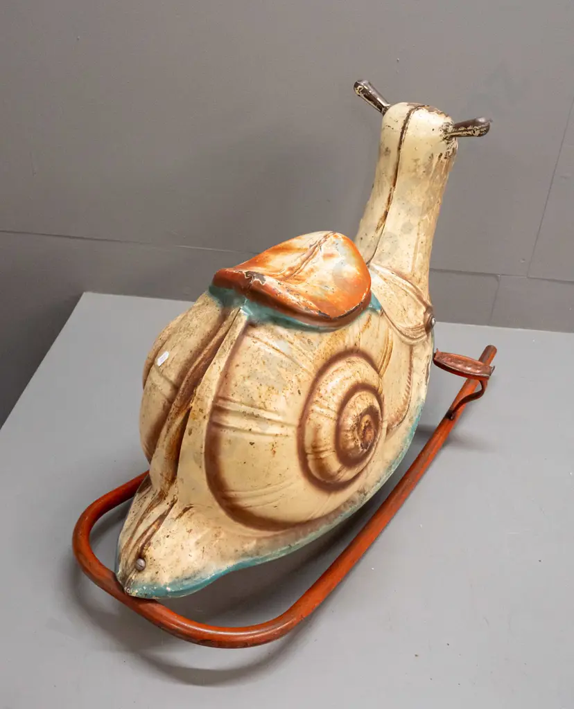 vintage pressed tin child's rocking snail - foot rests marked Mobo - separating down seam, has overall corrosion and Image 1++
