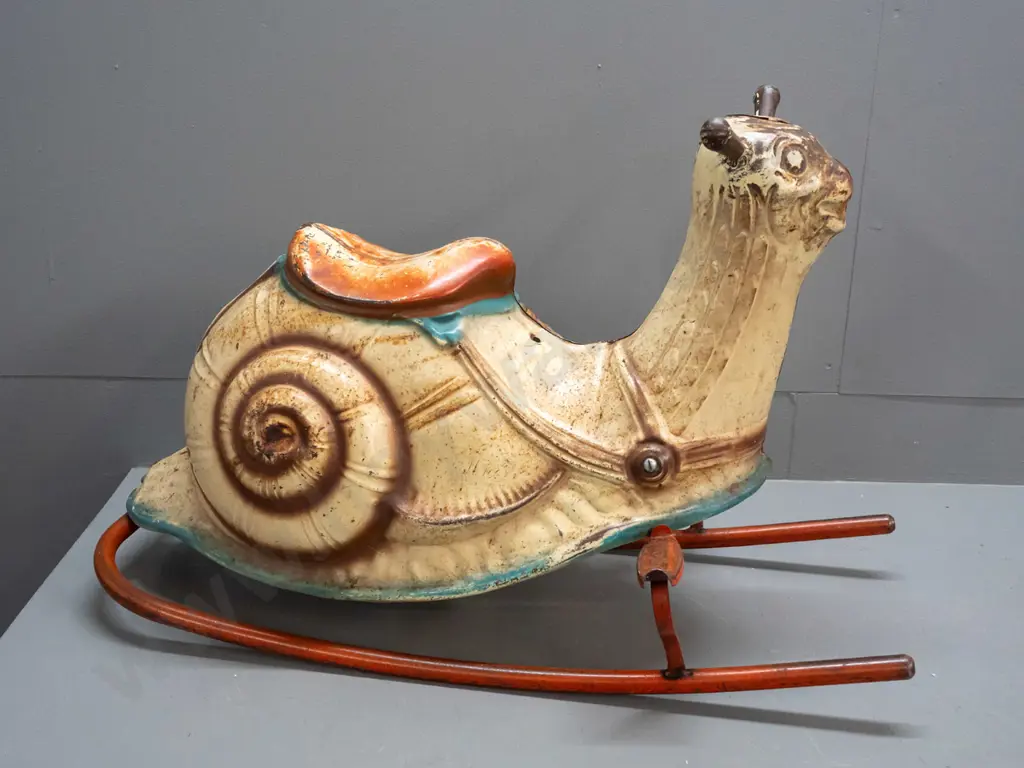 vintage pressed tin child's rocking snail - foot rests marked Mobo - separating down seam, has overall corrosion and Image 1++