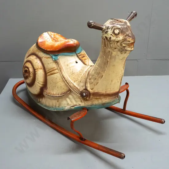 vintage pressed tin child's rocking snail - foot rests marked Mobo - separating down seam, has overall corrosion and