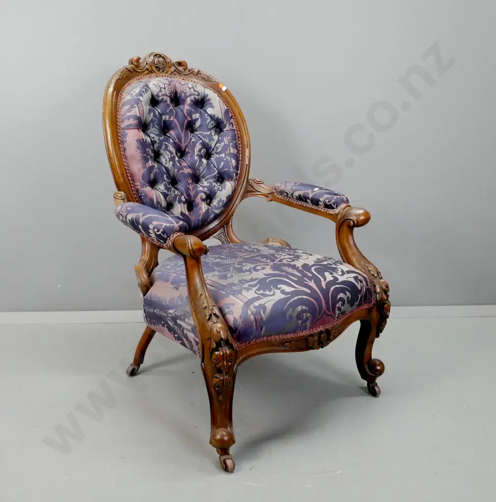 Victorian walnut open-arm gent's chair with carved cameo back, carved knees & cab legs, deep button back, on porcelain Image 1++