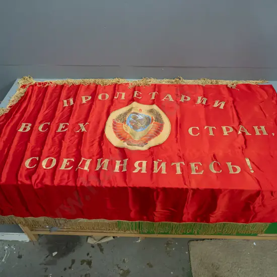 large Soviet era banner - red satin or silk fabric with gold tassel edging, hand painted lettering and central design,
