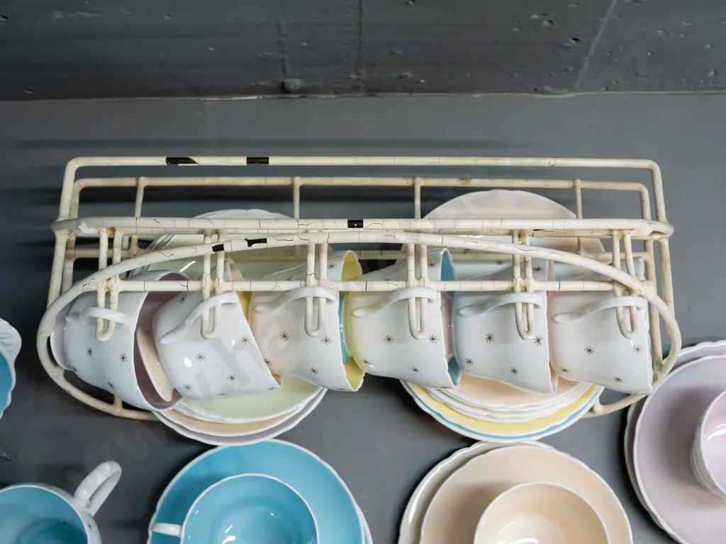 Shelley Pole Star tea ware - 9 trios, cake plate, cream & sugar with a plastic over wire stand. Slight scratch to cake Image 1++