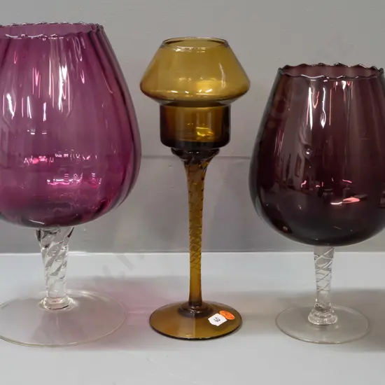 3 retro stemmed glass items - 2 clear stem amethyst goblet shaped, smaller is darker smoked colour, & a dark amber with