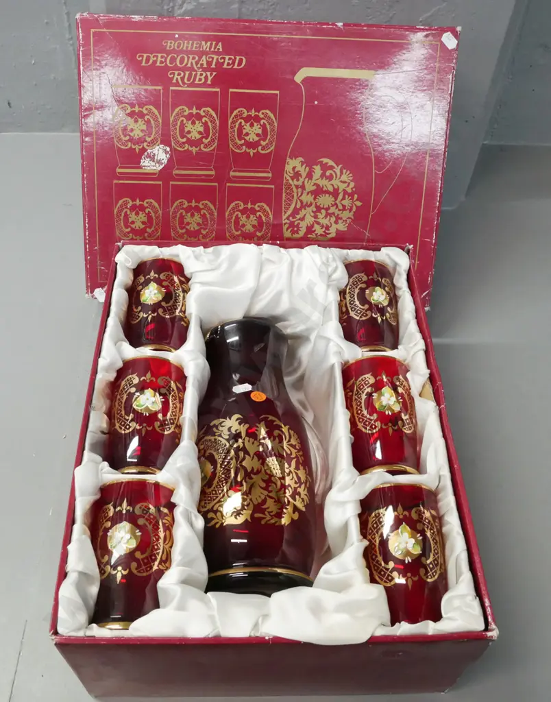 fitted box of Bohemian Ruby Glass set of carafe and 6 tumblers w/ gilded and raised enamel decoration. Jug H-260 Image 1++