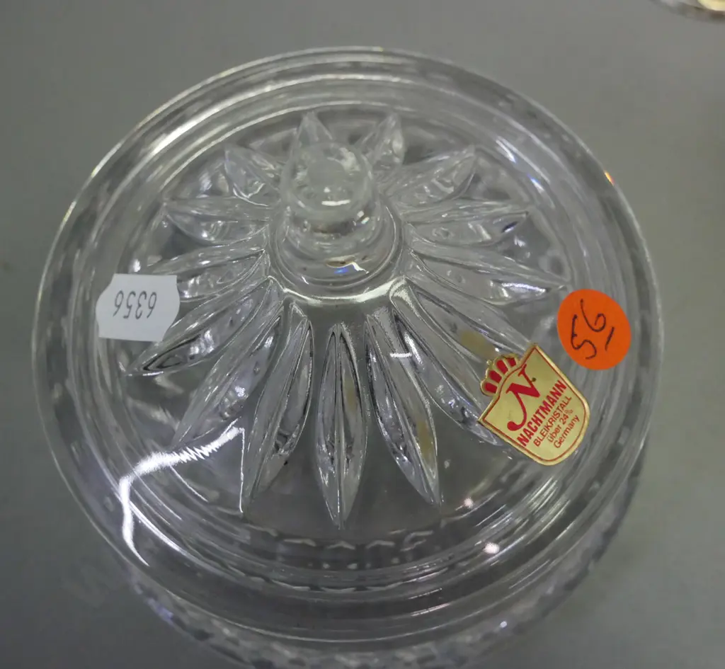 3 crystal items: 2x lidded canisters, 1x cut crystal bud vase marked Julia Made in Poland, 1x canister marked Nachtmann Image 1++