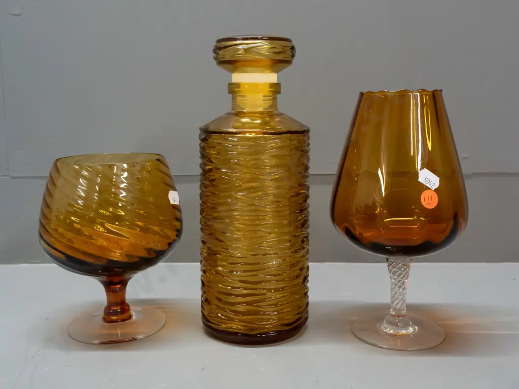 3 pieces of amber glass - ripple texture stoppered bottle H-260 & 2 goblets with clear base, one with fluted pattern Image 1++