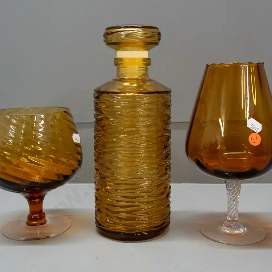 3 pieces of amber glass - ripple texture stoppered bottle H-260 & 2 goblets with clear base, one with fluted pattern