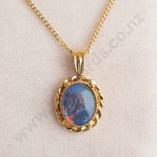 silver opal pendant stamped 925 with gold plated chain