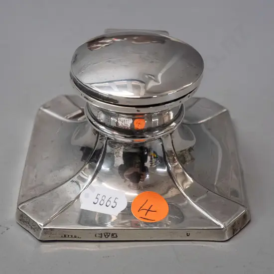 sterling silver inkwell with hinged lid and a porcelain liner - some dents to silver H-55 W-90 D-90