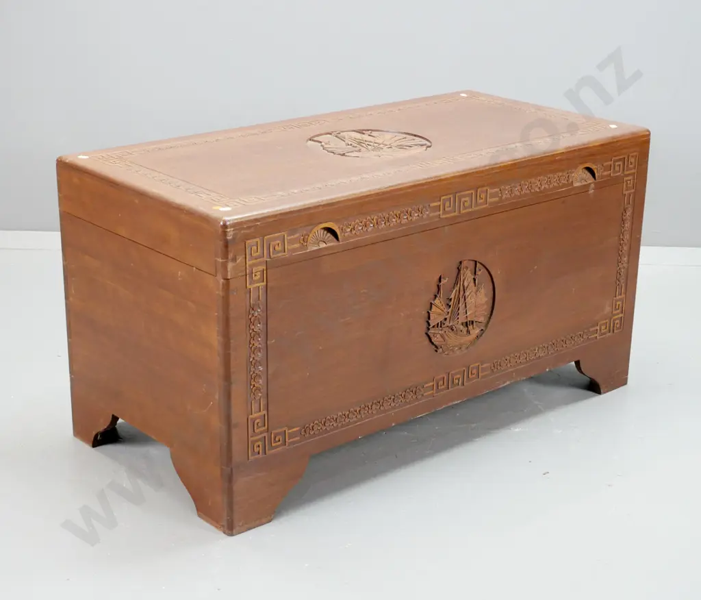 Chinese camphorwood-lined hardwood chest with carved floral decoration & circular carved junk scenes on top and front, Image 1++