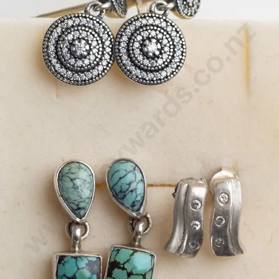 3 pairs of silver earrings
