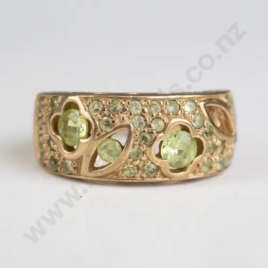 9ct multi stone peridot band ring (1 stone is missing) 5.9gms
