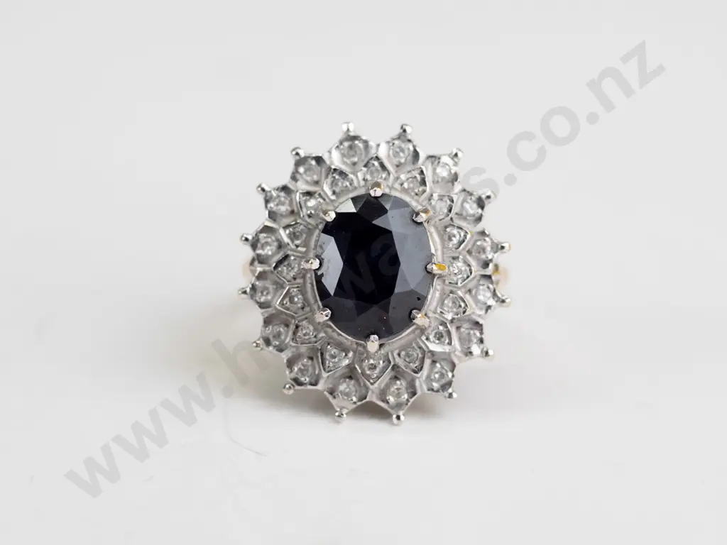 9ct sapphire [10x8] & 2 frier diamond ring 6.1 gms Image 1++