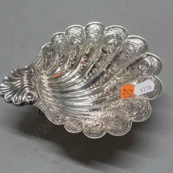 sterling silver shell shaped dish on 3 scrolling feet, hallmarked w/ DH&S. H-40 W-140